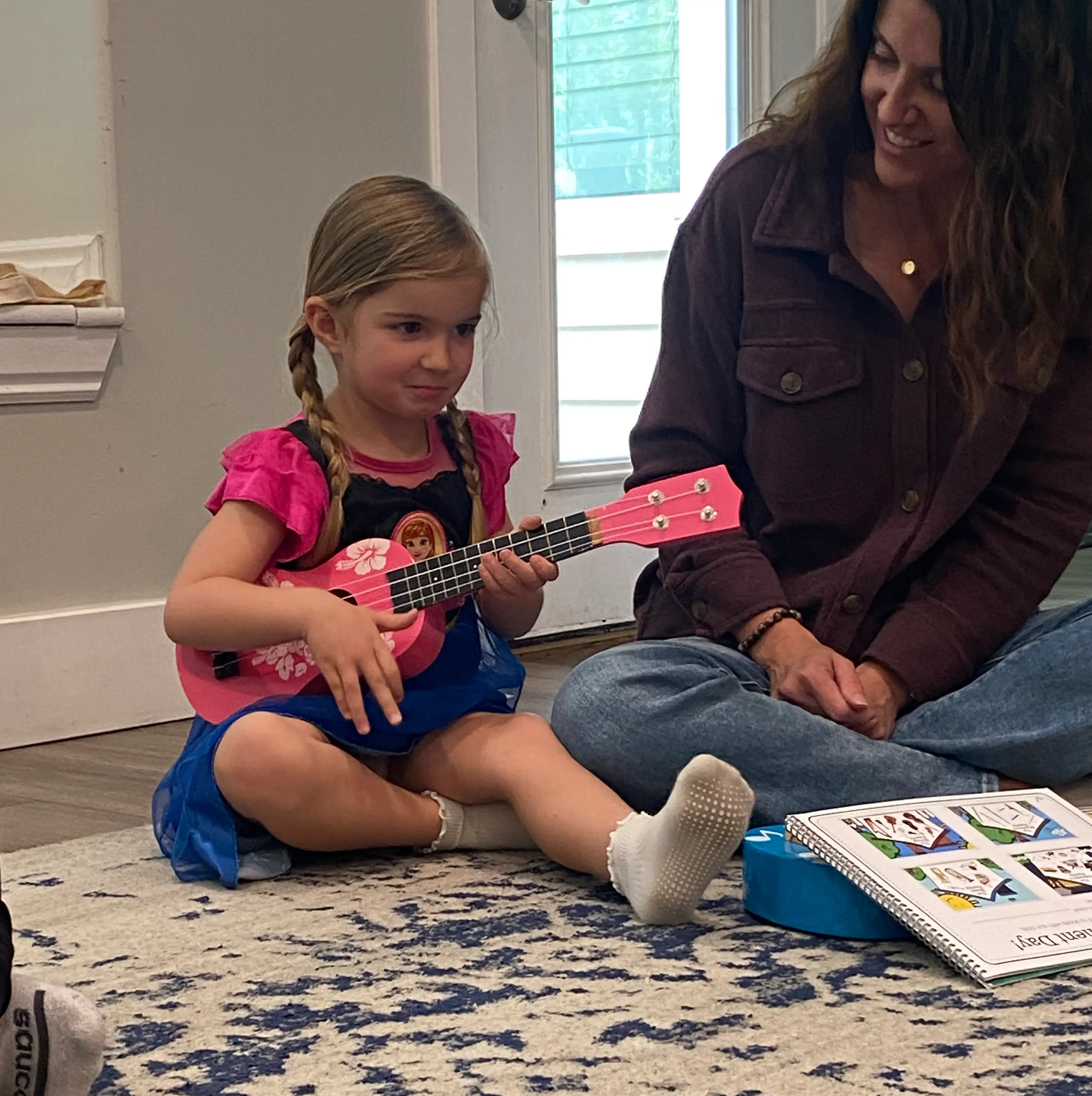 Toddler smiling during a music class
